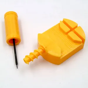 Detail view of a yellow plastic watch band link remover tool with punch pin.
