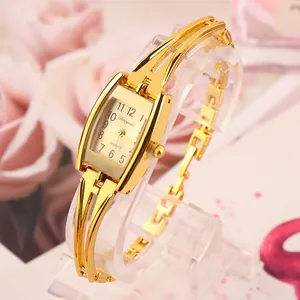 Detailed view of elegant gold-toned bracelet watch for women with quartz movement
