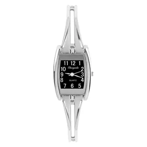 Macro view of silver bracelet watch with black rectangular dial and quartz movement
