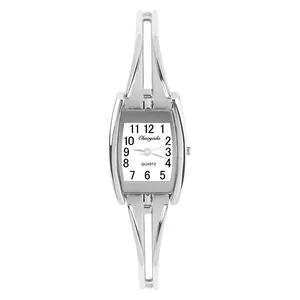Detail view of a vintage silver-tone bangle watch with minimalist quartz dial