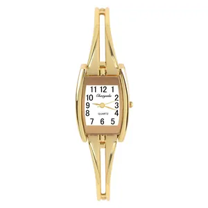 Detailed view of elegant gold women's bracelet watch with rectangular white dial.
