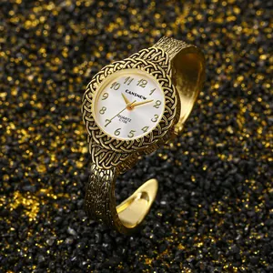 Primo piano dell'orologio rigido vintage dorato CANSNOW con eleganti dettagli intrecciati