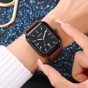 Primo piano di un orologio al quarzo rettangolare con quadrante nero e cinturino marrone