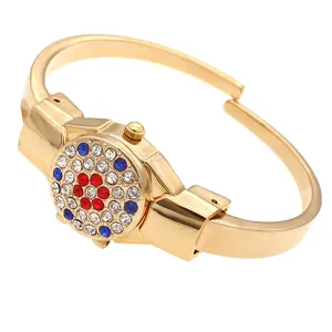 Elegant ladies flip-top bangle watch featuring red and blue rhinestone flower design
