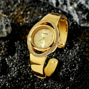 Vista dettagliata dell'orologio rigido CANSNOW dorato da donna con ghiera strass