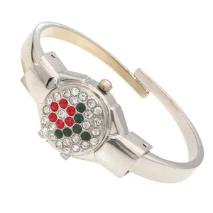 Elegant silver ladies bangle watch featuring a decorative red and green rhinestone flip cover