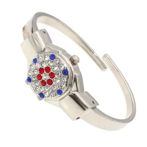 Close-up of elegant rhinestone-encrusted flip cover on ladies' silver bangle watch