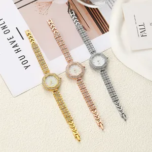 Detail view of flower-shaped rhinestone watches in gold, rose gold, and silver finishes.