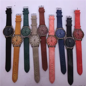 Collection of quartz watches featuring colorful faux denim straps and vintage bronze cases
