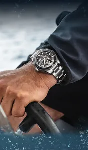 Detail view of Mark Fairwhale skeleton mechanical diving watch on a man's wrist
