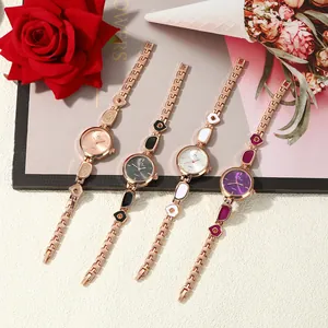 Close-up of four irregular rose gold bracelet watches with colorful enamel details