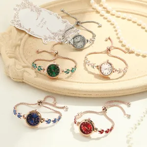 Detailed macro view of women's clover rhinestone bracelet watches in multiple vibrant color variants