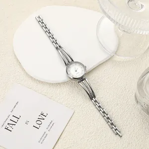 Detailed view of silver steel band ladies' watch with rhinestones