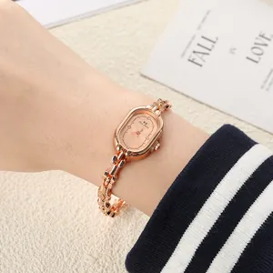 Detailed shot of an elegant rose gold oval women's bracelet watch on wrist