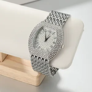 Macro view of full rhinestone tonneau watch with Roman numerals