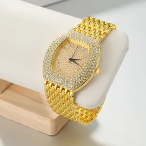 Luxury gold tonneau-shaped women's watch with iced-out rhinestone bezel and dial