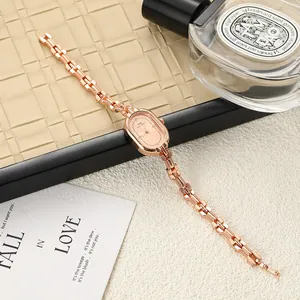 Elegant rose gold oval women's watch with a minimalist dial and link bracelet detail