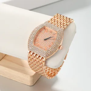 Close-up of luxury rose gold tonneau watch for women with full crystal pave dial