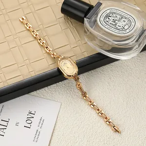 Close-up of vintage gold lady's watch with an elegant oval dial and bracelet strap
