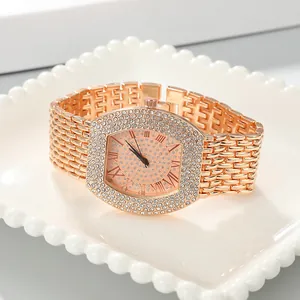 Detailed close-up of a luxury tonneau-shaped women's watch with rhinestone setting