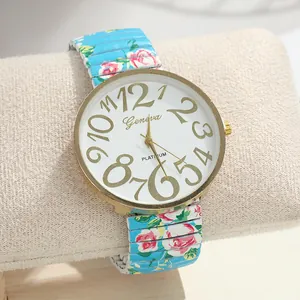 Close-up of ladies quartz watch with rose print elastic strap and large numeric dial