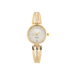Detailed view of elegant gold women's quartz watch with rhinestone steel strap