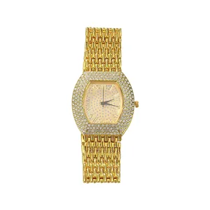 Elegant gold tonneau women's watch featuring a full rhinestone bezel and Roman dial