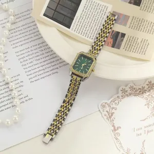 Elegant women's square green dial quartz watch with gold and silver two-tone steel strap.
