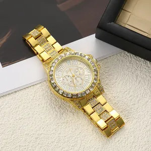 Detailed macro view of a luxury gold watch with iced-out crystal dial and strap.