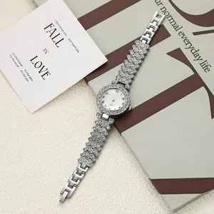 Detailed macro shot of an elegant silver quartz wristwatch with sparkling crystal bracelet