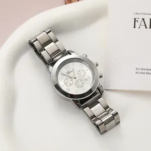 Detailed view of a silver Geneva women's quartz watch with a metal link strap and white dial