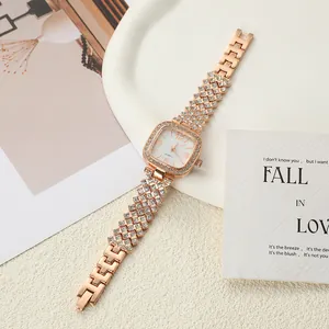 Close-up detail of rose gold square women watch with rhinestone-studded bezel and bracelet