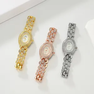 Top view of three luxury rhinestone-studded oval watches in gold, silver and rose gold