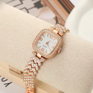 Detail of rose gold square quartz watch with rhinestone encrusted link bracelet