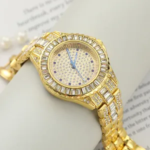 Close-up of luxury gold iced-out women's watch with blue hands and rhinestones
