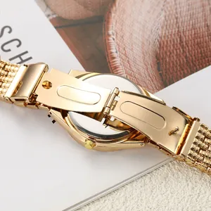 Detailed back view of gold quartz watch showing alloy case and metal clasp