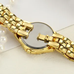 Detailed close-up of the back case and gold-tone steel strap of the ladies quartz watch
