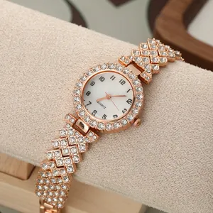 Detailed view of rose gold ladies quartz watch with full rhinestone paved bracelet.