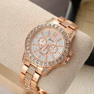 Close-up of women's rose gold watch featuring a full crystal bezel and elegant dial details
