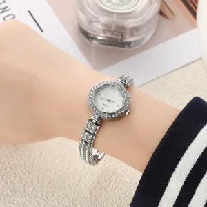 Close-up detail of a silver floral diamond-encrusted quartz bracelet watch for women.