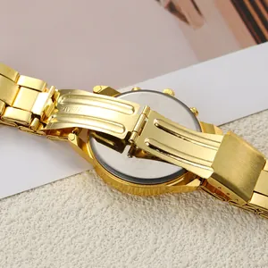 Detailed view of the golden metal strap and stainless steel case back of a women's quartz watch.