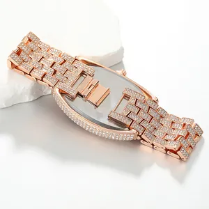Detailed view of luxury rose gold iced-out women's watch with crystal-encrusted band.