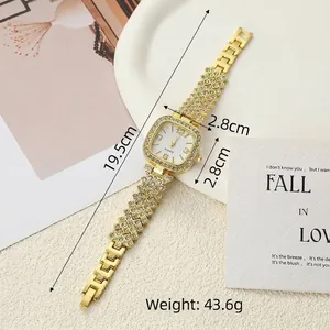 Detailed view of women's square quartz watch with gold rhinestone strap and size markers