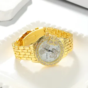 Elegant gold women's watch with rhinestone butterfly dial and alloy strap detail view.