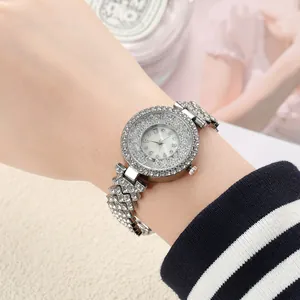 Close-up detail of women's quartz watch featuring full rhinestones and floating beads