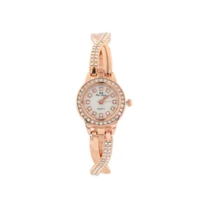 Elegant rose gold women's quartz watch featuring rhinestone crisscross bracelet and round dial.