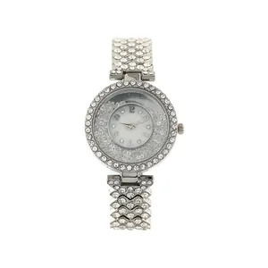 Macro detail of elegant silver rhinestone quartz watch with mobile crystal beads on dial