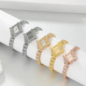 Close-up view of five elegant diamond-studded women's quartz bracelet watches in multi-color