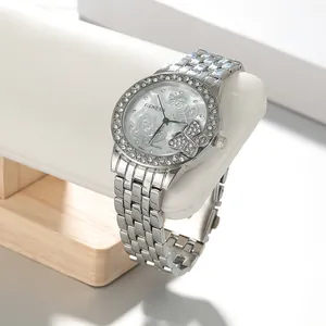 Detailed shot of a silver-tone ladies' watch with rhinestone bezel and butterfly dial