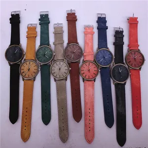 Collection of fashion quartz watches with colorful faux denim straps and bronze cases.